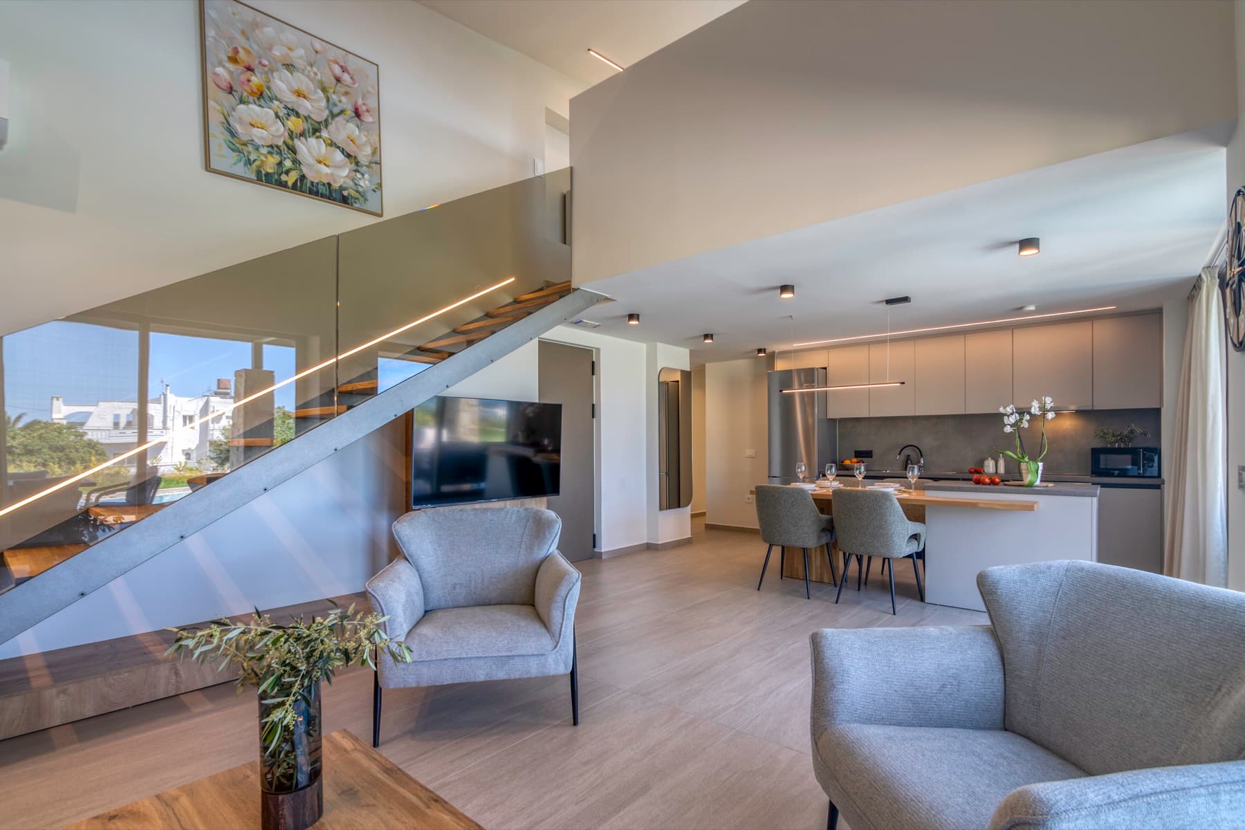 Living room, kitchen and staircase