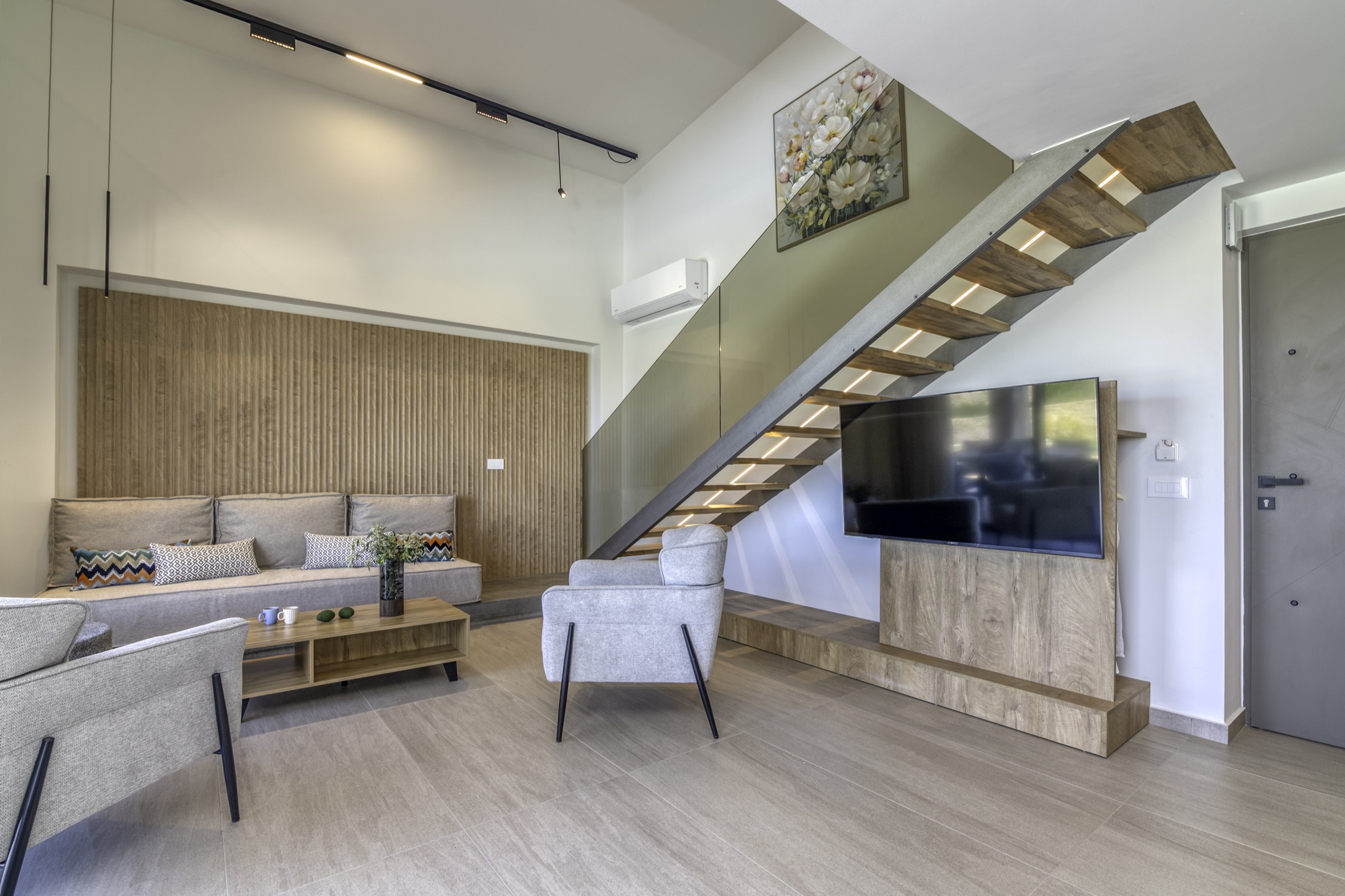Open-plan living room with staircase