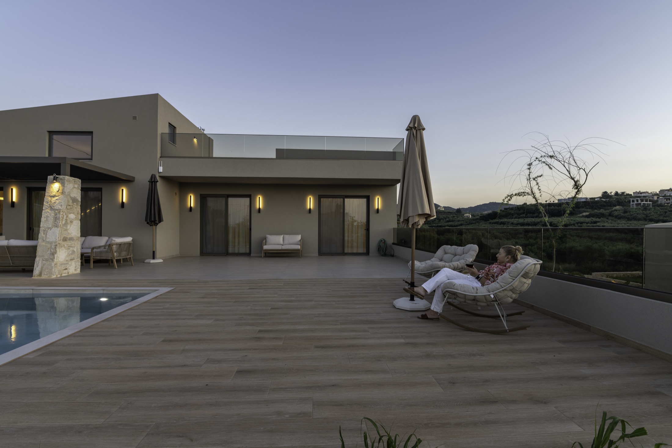Villa terrace and pool at dusk